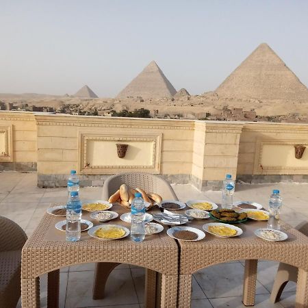 ホテル Hussien Lotus Pyramids View カイロ エクステリア 写真